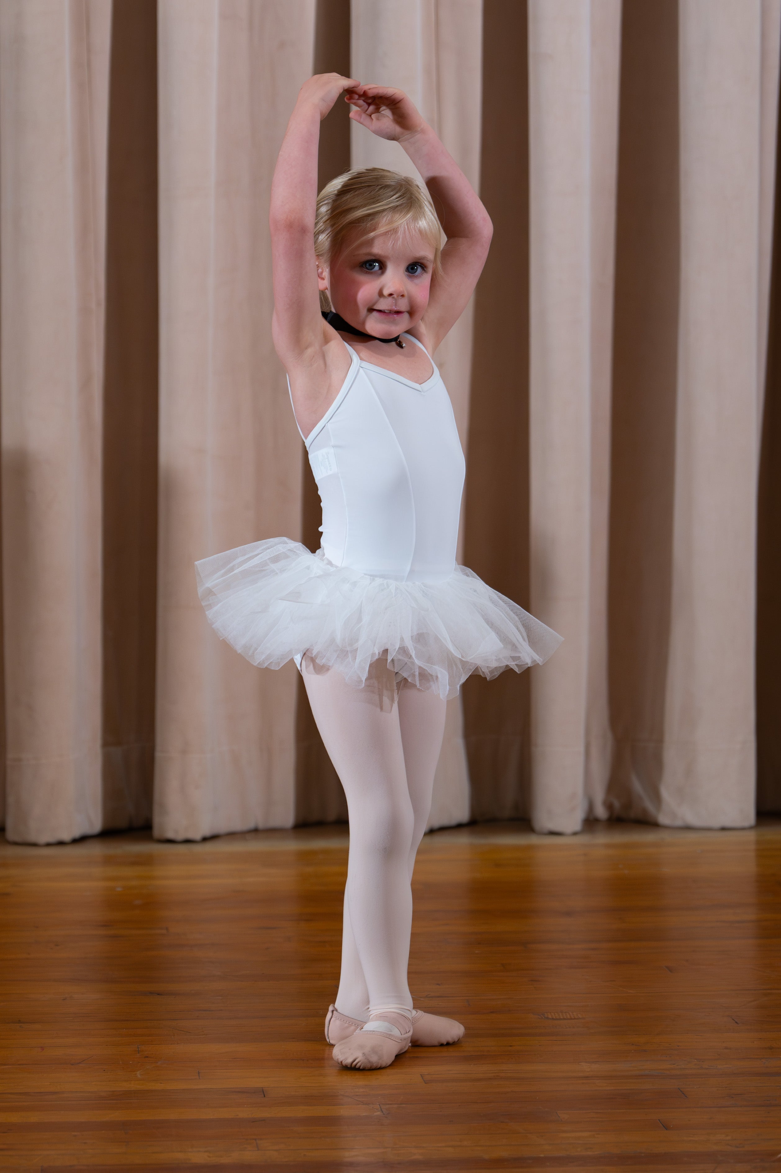 A little ballerina in a white tutu