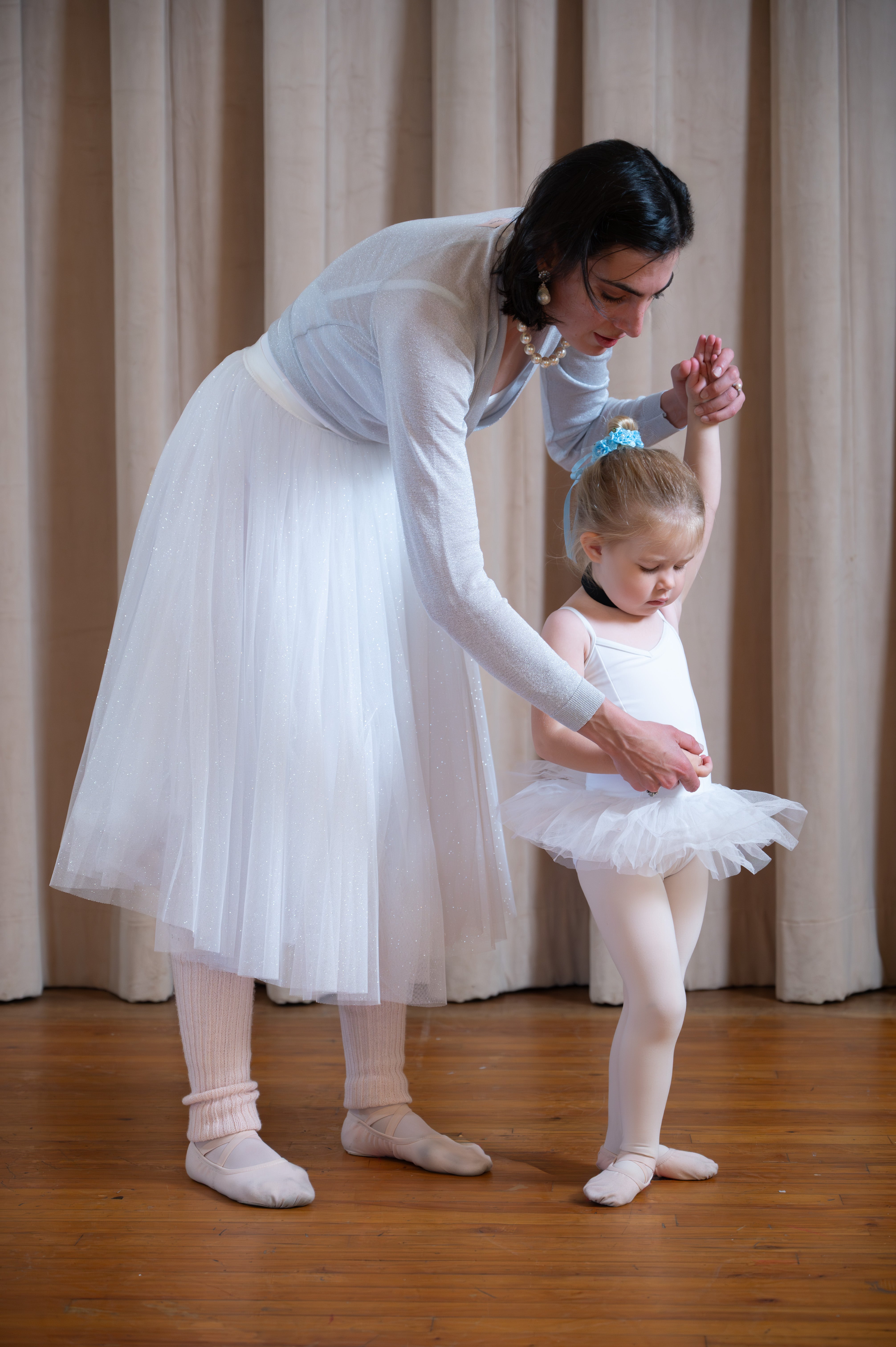 Miss Camille teaching a young ballerina